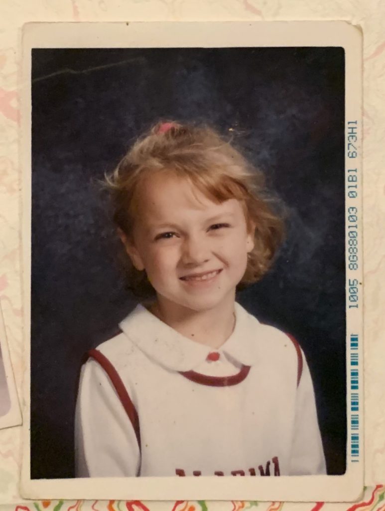 Little Michelle at one of her first school picture days where labels tend to begin
